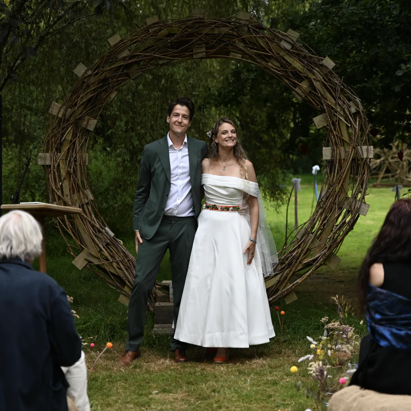 The couple under the woven willow arch at Selgars