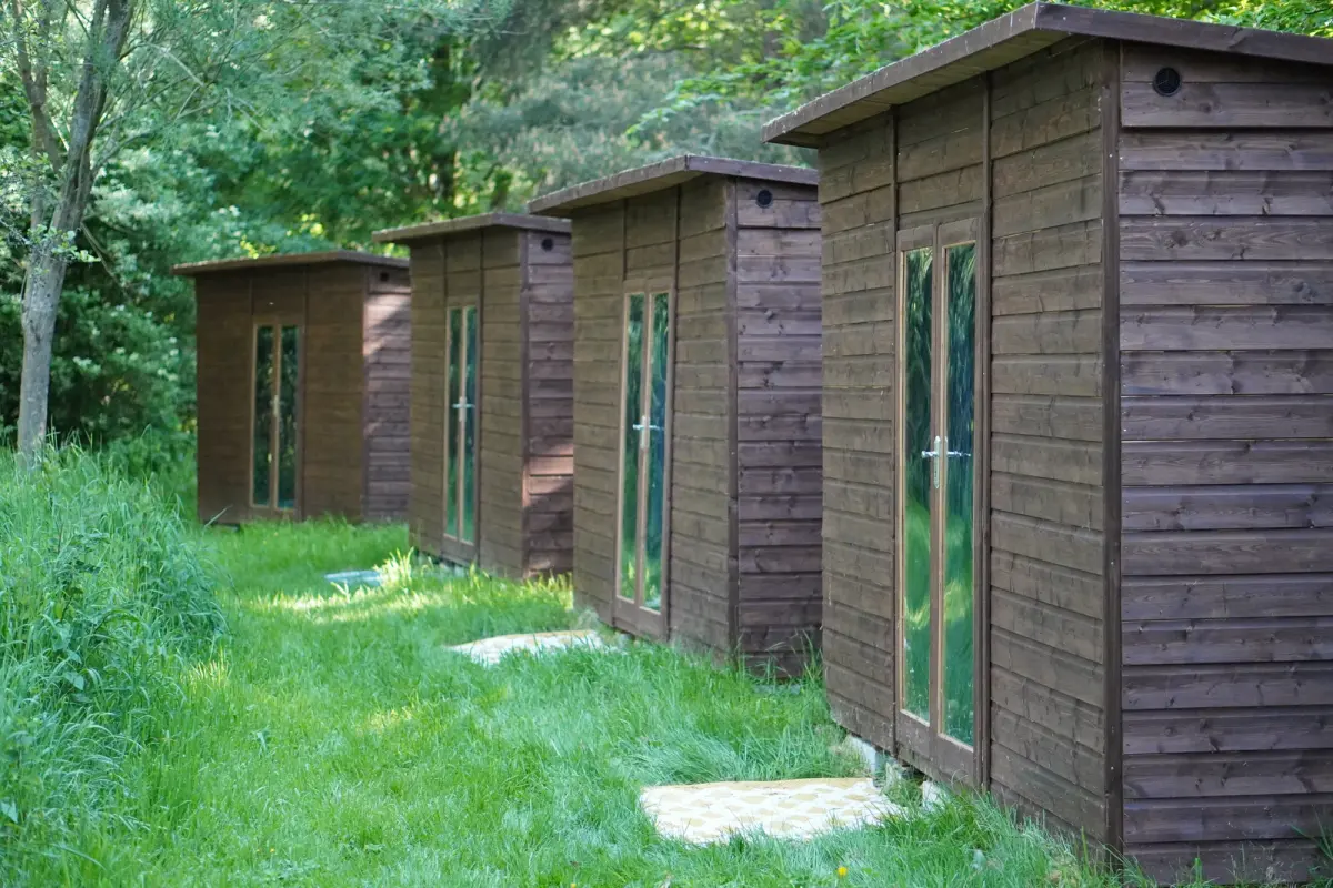 The row of summerhouse cabins among the bare winter trees
