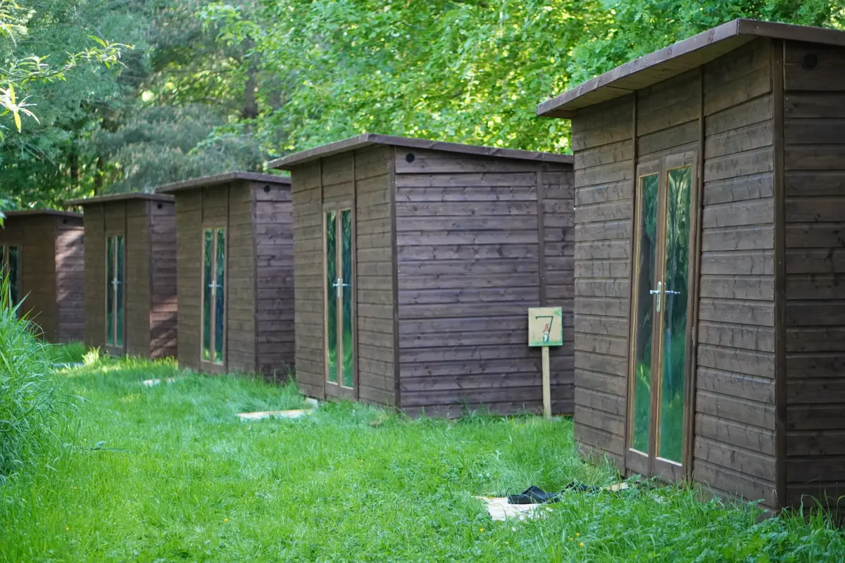 Cabins facing each other across the grass track