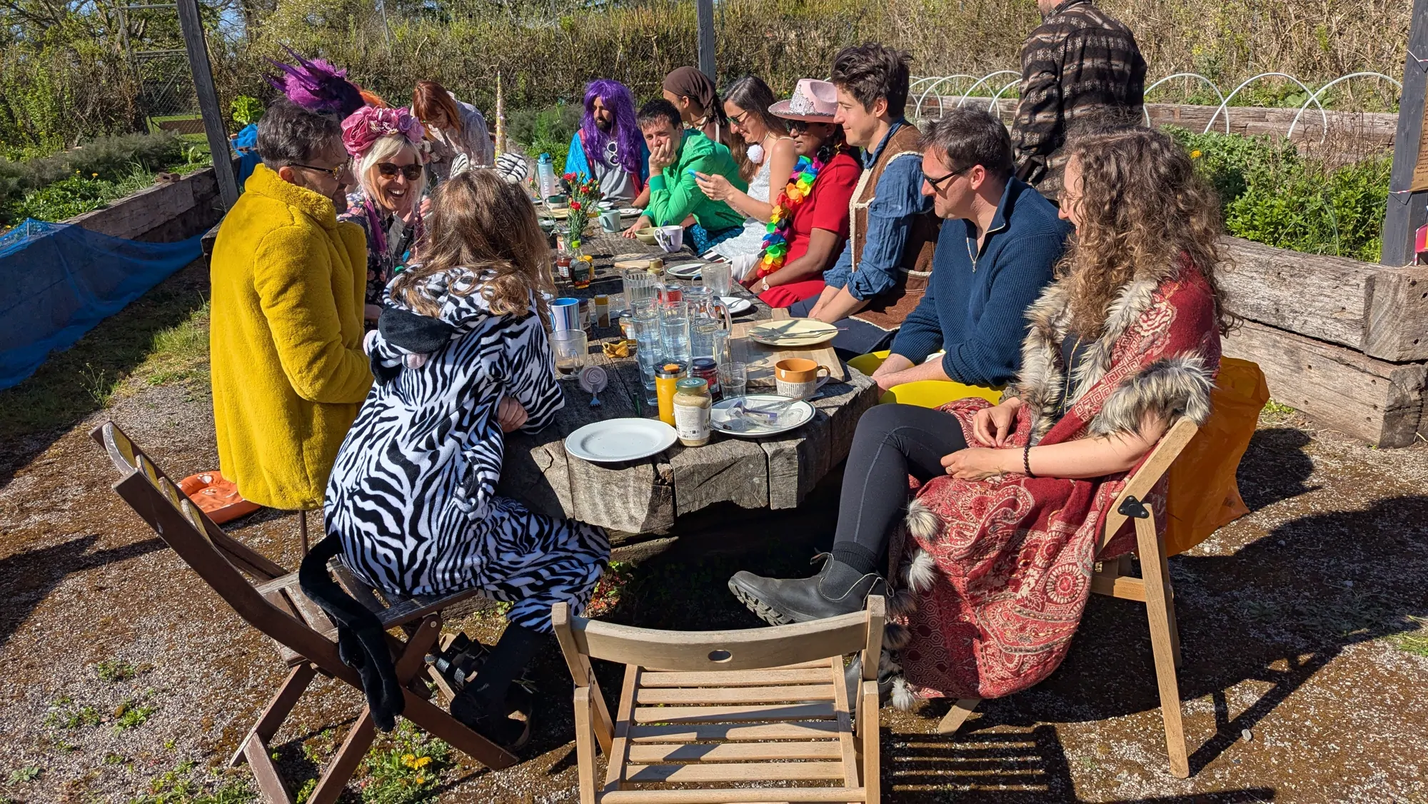 A long lunch in fancy dress out by the vegetable beds